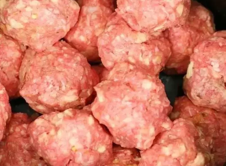 Put meatballs in a slow cooker, but the next 2 ingredients will make it special