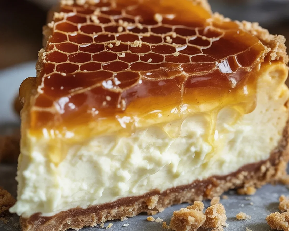 honeycomb-cheesecake-2025-10-24-075414 Delicious Honeycomb Cheesecake with Biscoff crust and creamy topping.