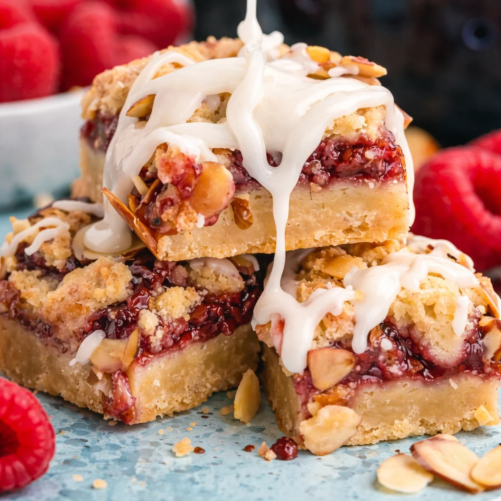 Delicious Almond Raspberry Bars with buttery crust and crunchy almond topping