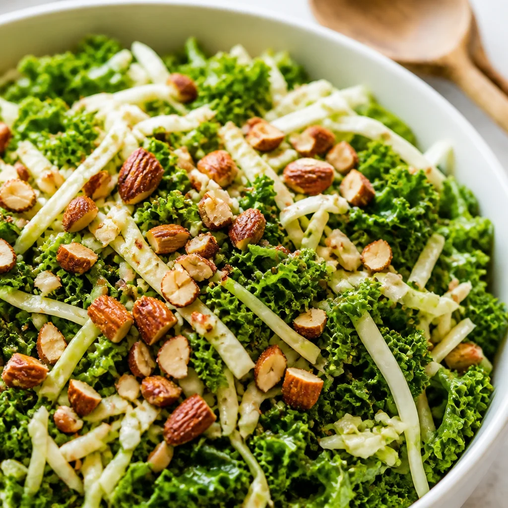 Copycat Chick-fil-A Kale Crunch Salad with kale, cabbage, and roasted almonds in vinaigrette.